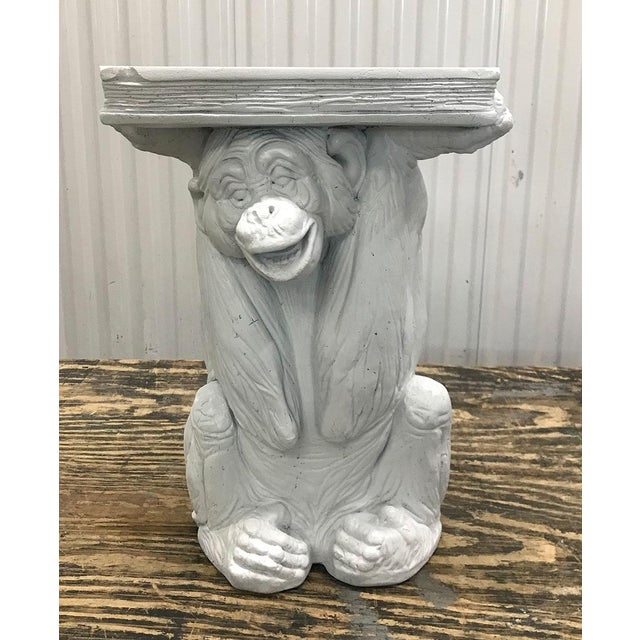 Charming vintage table, circa late 1980s. Plaster form depicting in exquisite detail a monkey holding a book. Book table...