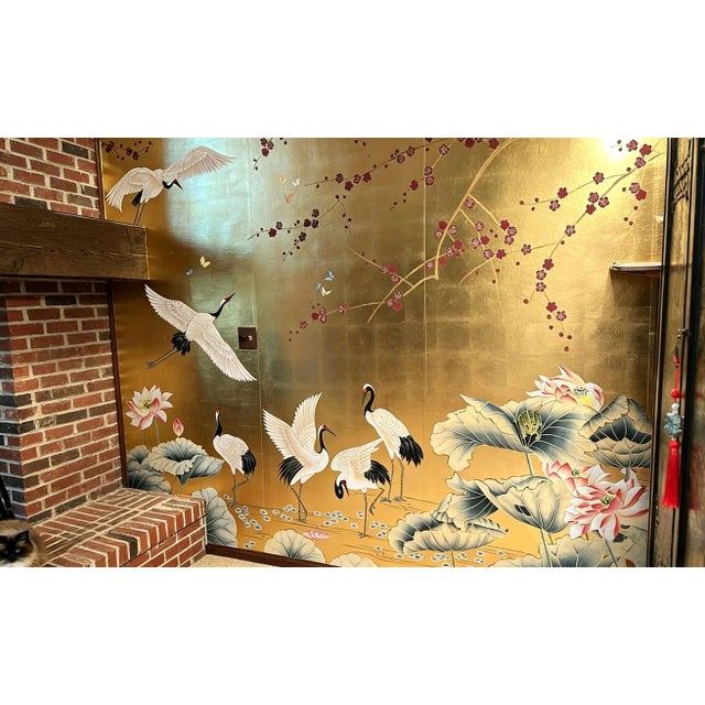 Luxury artisan hand-painted mural crafted with premium gold leaf backing, blending elegant dark plum blossom branches and...