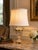 A stunning crystal and brass table lamp, designed in the Neoclassical style with elegant urn form. The lamp features a...