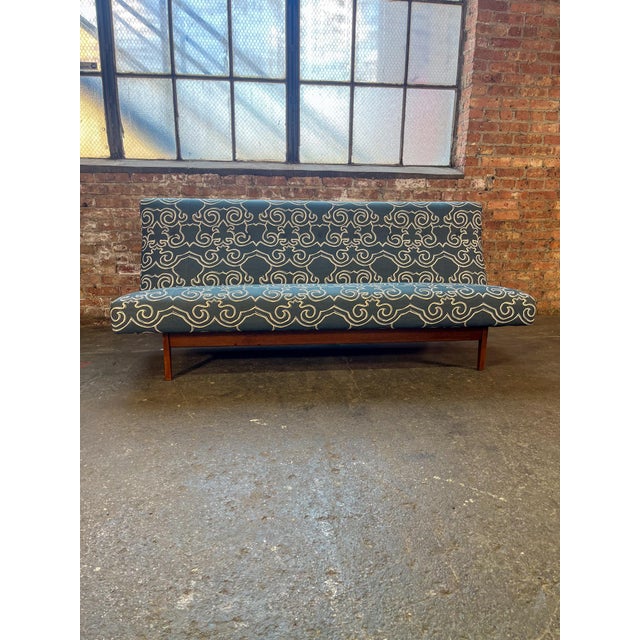 Unique sofa attributed to Jens Risom Model-250 High-back armless slipper sofa. Upholstered in a fun blue patterned fabric....