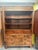 An exceptional antique mahogany cabinet of impressive proportions, combining the elegance of a linen press with the...