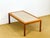Elegant Scandinavian-inspired coffee table from the 1960s. The frame is made of solid teak and teak veneer, offering a...