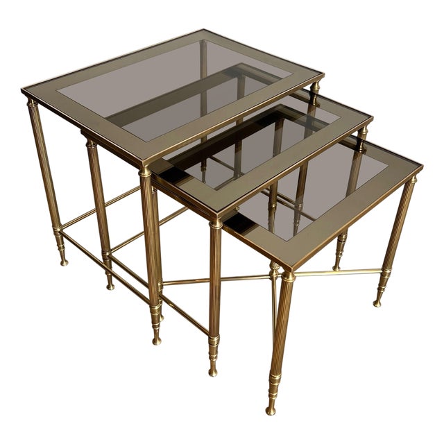 1940s Neoclassical style brass nesting tables. French work by Maison Jansen. For Sale