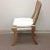 Modern Upholstered Klismos style chair. The chair is upholstered in off white chenille with attached cushion. The chair is...