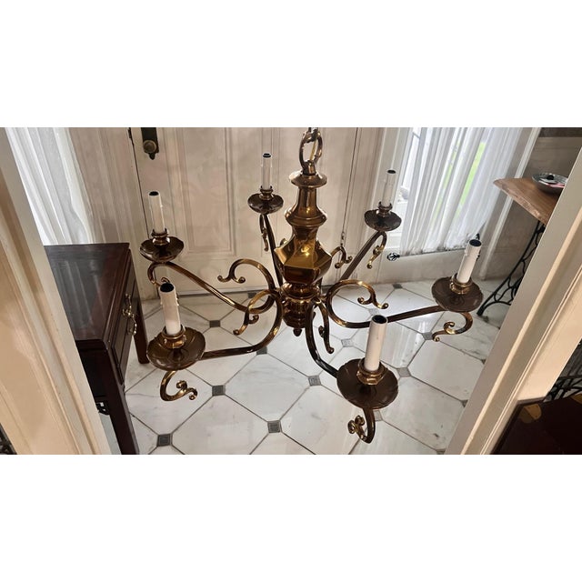 Beautiful solid brass chandelier from a Massachusetts mansion estate sale. Retailed for $3500. There is no maker's mark....