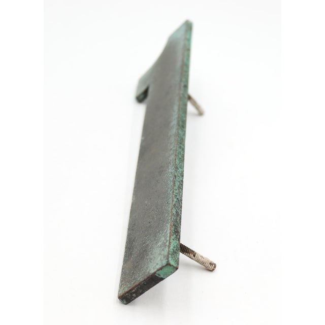Vintage sans serif style number 1 sign made of bronze with a dark bronze and verdigris finish. The piece is flat on the...