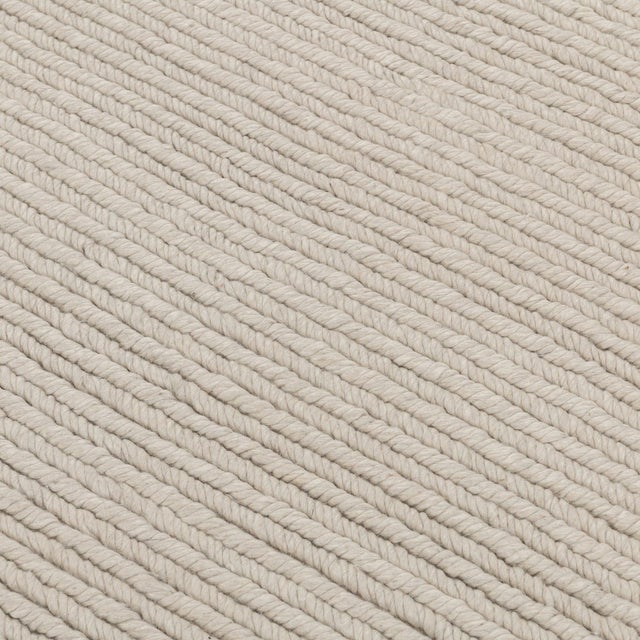 Wool polyester cozy rug in tones of whites and creams. Subtle herringbone patterning. Classic yet modern; perfect for a...