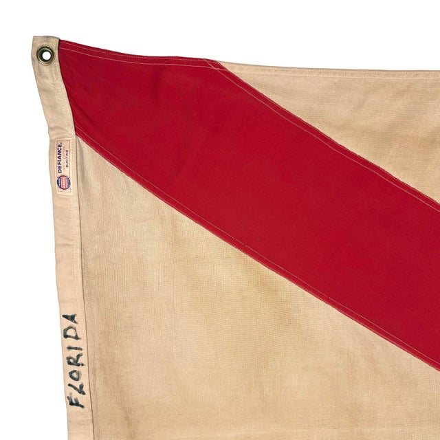 This vintage Florida flag is made from a cotton cloth with fully sewn saltire cross. Printed emblem is slightly askew and...