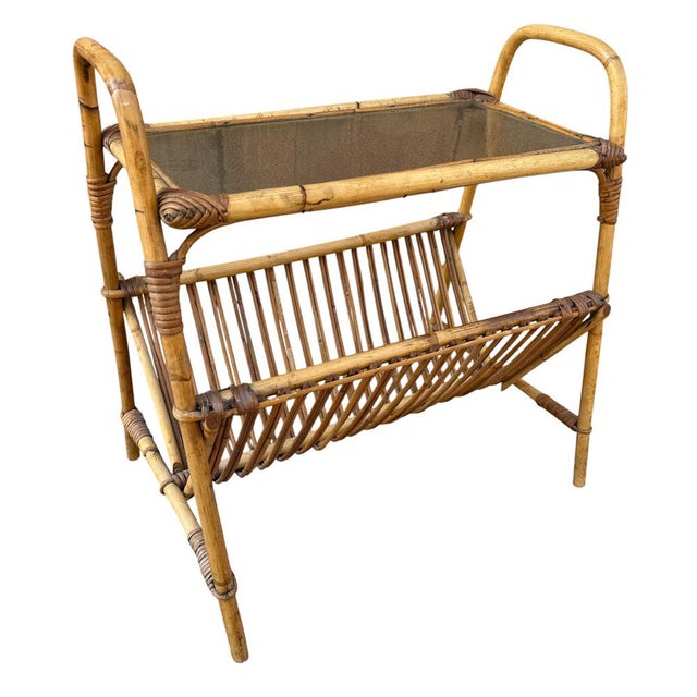 Mid-century Italian rattan and bamboo side table with a glass top and magazine rack, 1950s. Handcrafted. Top height 49 cm