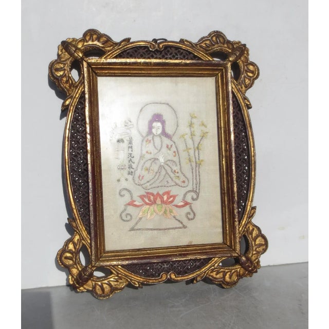 Mid-century Chinese needlepoint Kuan Yin in embroidery stitch, featuring a classical Chinese fret frame with gilt...