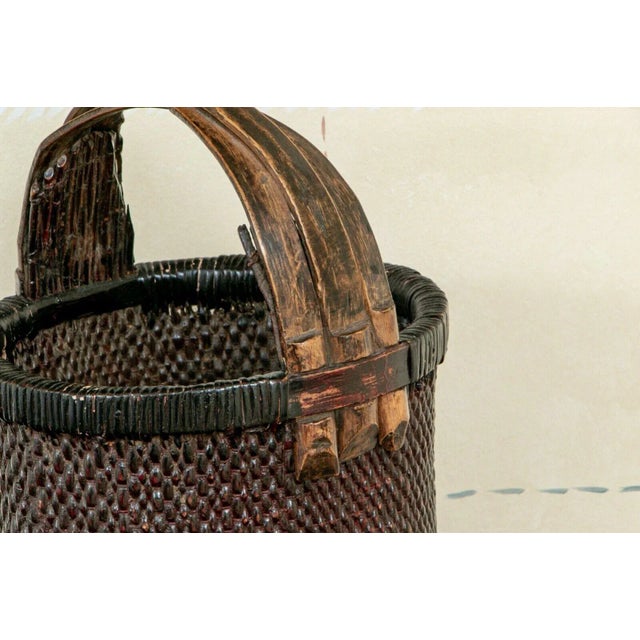Antique Hand Woven Chinese Rice Gathering Basket An antique Chinese tightly hand woven rattan rice gathering basket with...