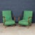 An elegant pair of lounge chairs that exemplify mid-century Italian craftsmanship, featuring gently curved wooden arms and...