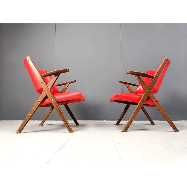Very rare mid century italian design armchairs by Dal vera. Beautiful mid century design with beech wood frames and skai...