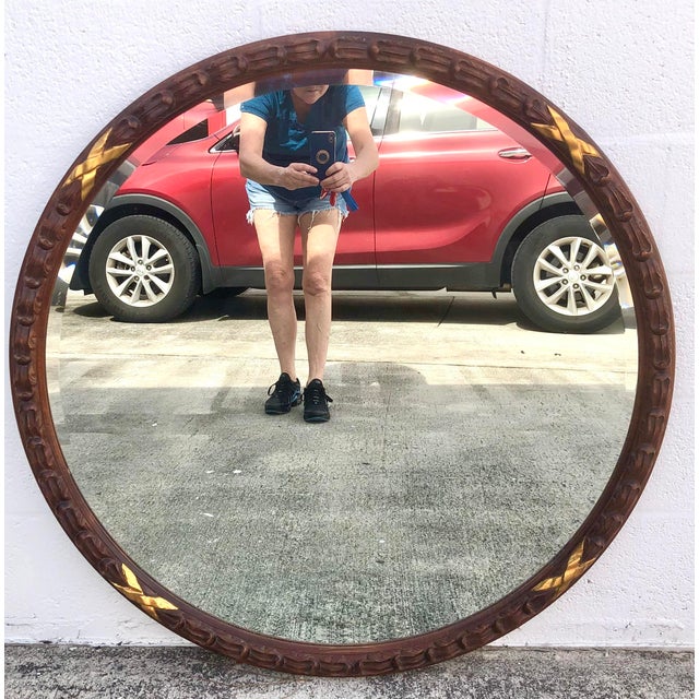 Beautiful large, round, early 20th century Harrison & Gil by Dauphine mirror. Solid wood, hand carved with gold accents....