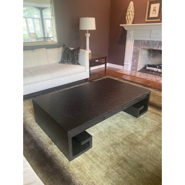 An iconic, statement-making "Scroll" cocktail table designed by Thomas Pheasant for Baker Furniture. This piece features a...