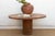 A grand-scale centerpiece, this 60-inch dining table is crafted from solid planks of reclaimed Burma Teak. The historical...