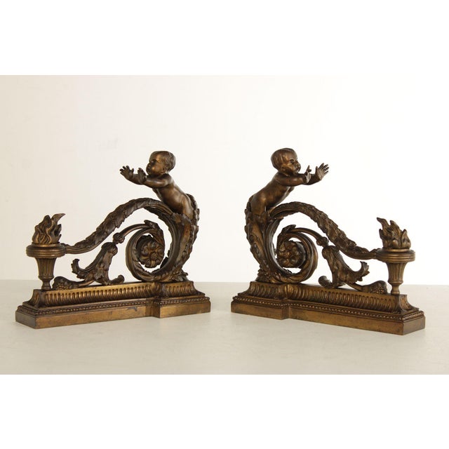 High Quality Antique 19th Century Pair of Bronze Fireplace Chenets with Scrolling Acanthus Leaf Accent Topped with Putti