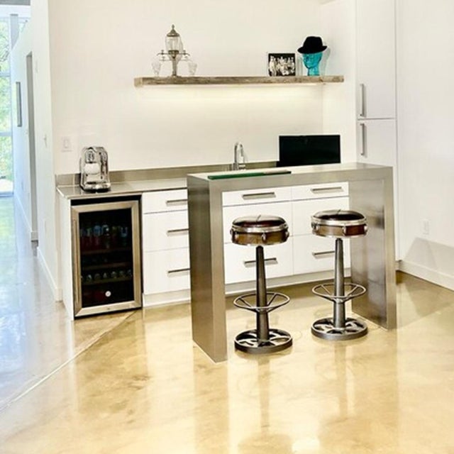 A bold minimalist coffee table handcrafted from brushed stainless steel and engineered with a concealed heavy-duty...