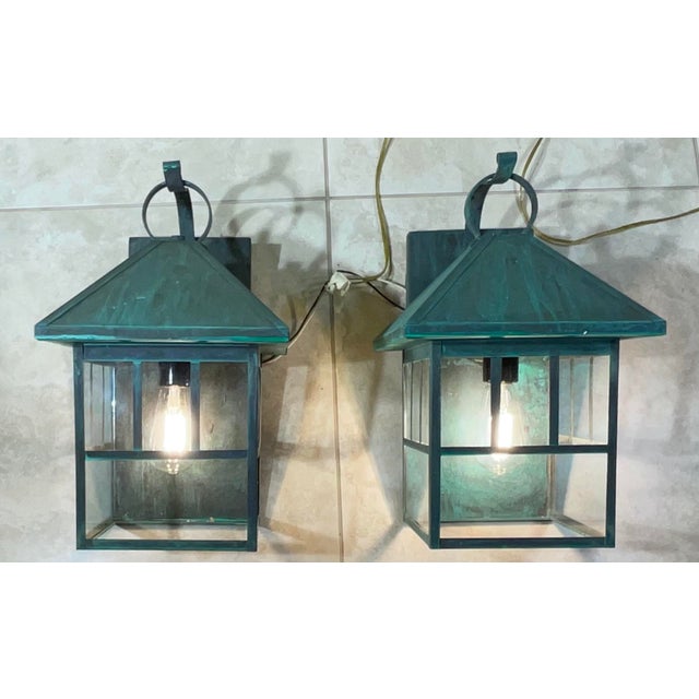 Elevate your home’s curb appeal with this pair of vintage solid brass wall-mount lanterns. These fixtures embody the Arts...