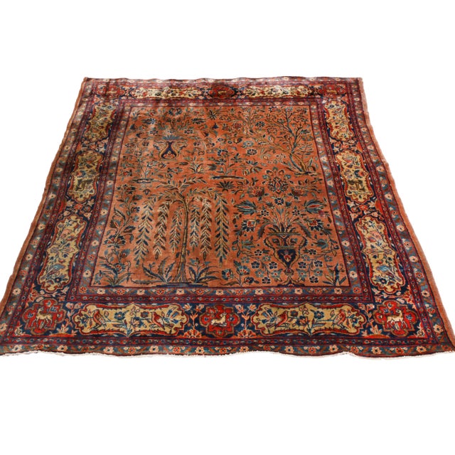 Originating from Persia in 1890, this hand-knotted antique Kashan Persian rug enjoys high-quality wool and copper and red,...