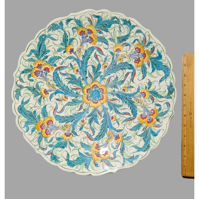 This vintage platter tray is a stunning piece of art pottery that will add a touch of elegance to any space. Measuring...