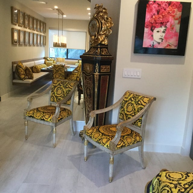 Pair of Robert J Scott chairs. The upholstery is versace barrocco gold black velvet this chairs are one of kind upholstery...