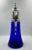 This gorgeous Austrian Cobalt blue glass pitcher has a detailed alpaca or "German silver" top. The contrast between the...
