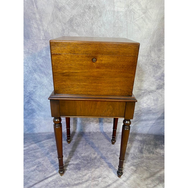 This vintage humidor makes an elegant statement with its warm mahogany tones and small brass-engraved monogram plate. This...