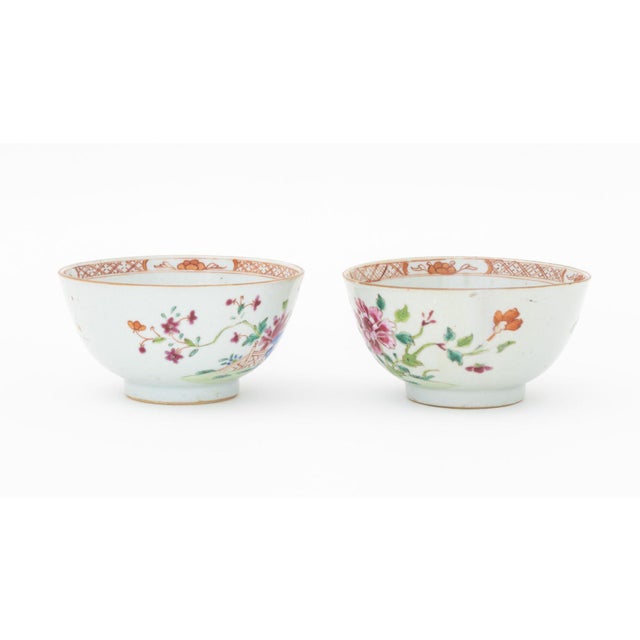 Pair of Chinese Export Famille Rose Porcelain Tea Bowls, each hand-enameled with flowers. 2.5" H x 4.5" Diameter....