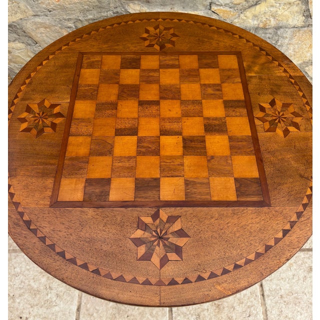 Charming mid-20th century Spanish game table featuring a beautifully inlaid chessboard top. The circular surface displays...