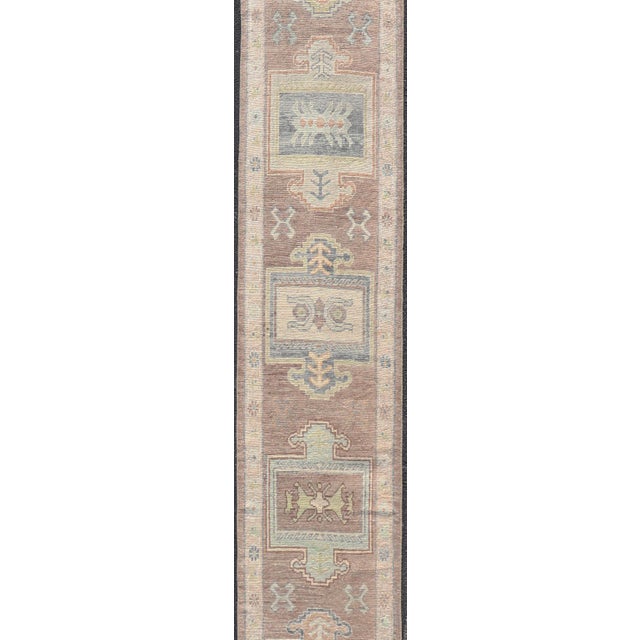 Tribal Long Turkish Oushak Runner in Pale Taupe With Blue and Soft Green Motifs For Sale - Image 3 of 12