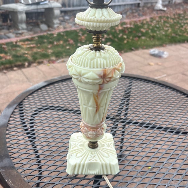 This a pretty little slag glass lamp by the company Akro Agate that was made during the Depression, 1930’s. It is beige...