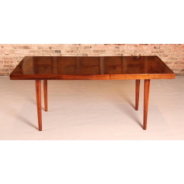 Danish Mid Century extending rosewood dining table by Nanna Ditzel, circa 1960s. Extends to 230cm to seat up to 10 people....