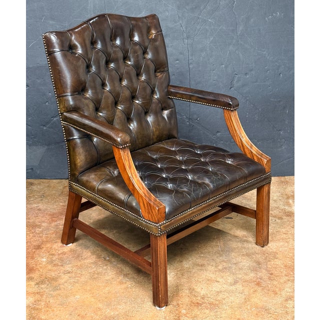 A fine Gainsborough library armchair or lounge chair upholstered in patinated leather from England - featuring a high...