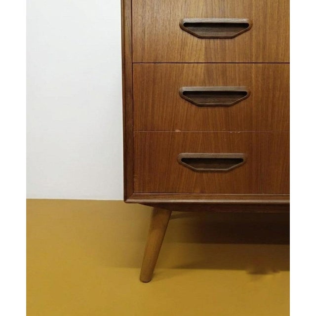 Vintage Danish teak chest of drawers from the 1950s with six drawers and integrated handles, featuring an elegant vertical...