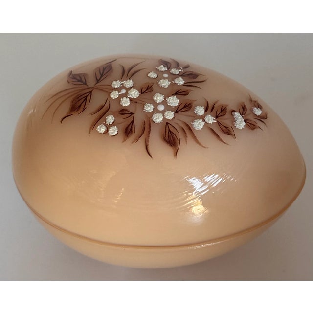 Decorative yet functional, here is a Westmoreland Glass egg shaped trinket dish with hand painted lid. Made in the 1960's...