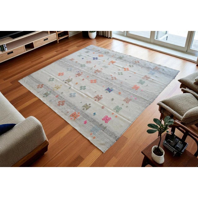 This exceptional mid-century Sofreh kilim from Central Anatolia represents an authentic artifact of Turkish village...
