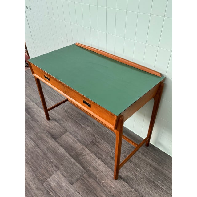 A desk with two beech wood drawers and a green Formica top. Made in Italy in the 1960s, imitating the Danish model...
