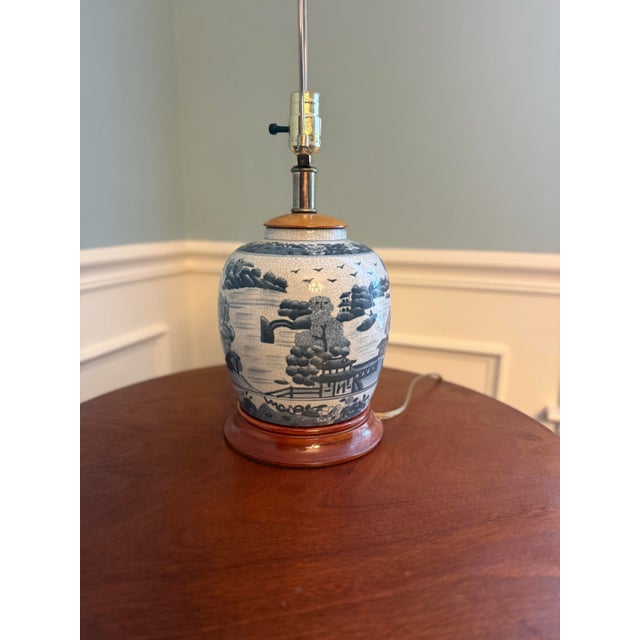 Add timeless traditional elegance to your space with this stunning blue and white ginger jar table lamp. Featuring a...