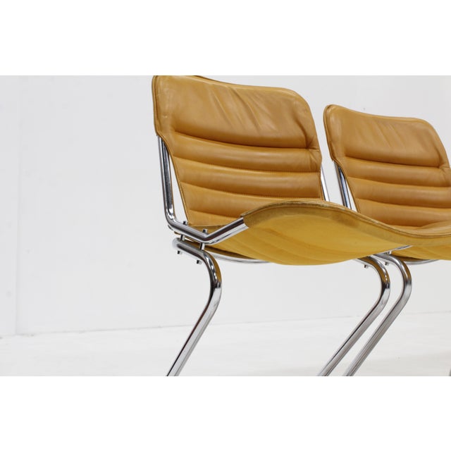 Set of 6 vintage chrome and leather dining room chairs from the 1970s Italy. Cognac yellow leather upholstery with chromed...