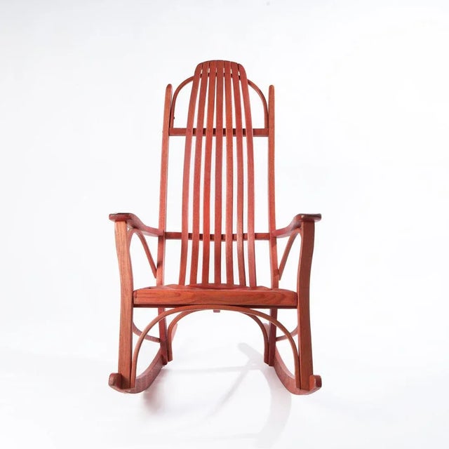 Charming Vintage porch rocking chair in red. This bentwood rocker has a slatted back and seat. It is surprisingly...