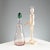 Blown glass bottle with green cap. Signature of the designer and manufacturer's sticker. Bottle height 29 cm. Original...