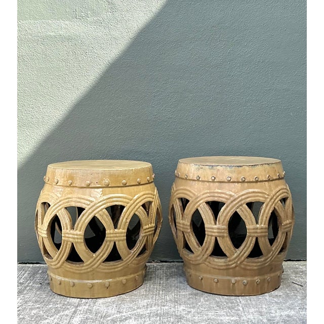 Elevate your interior or exterior space with this striking pair of vintage glazed ceramic garden stools. Featuring a...