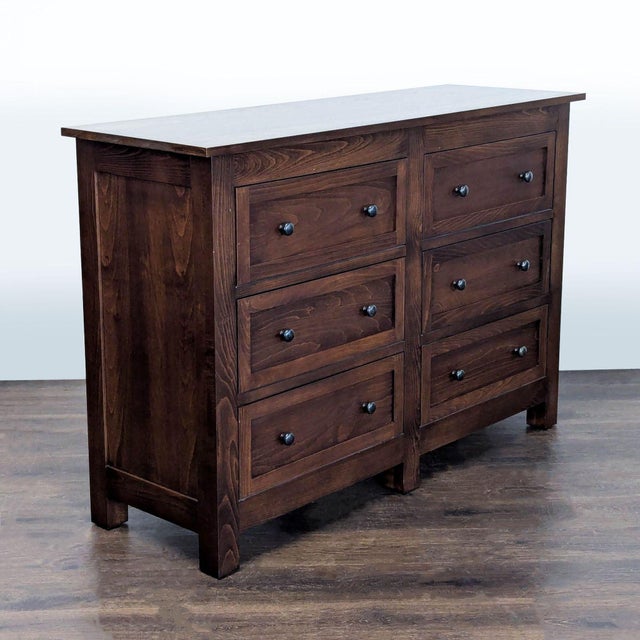 This Room & Board dresser features a solid dark brown wood construction with a classic design. It offers six spacious...