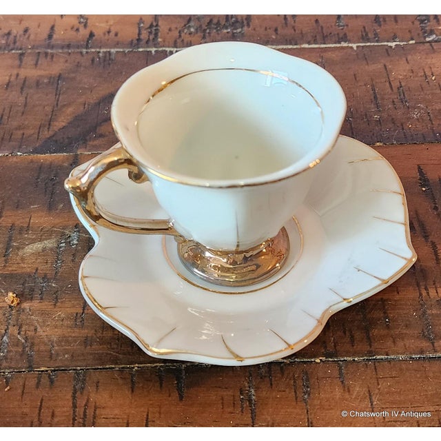 Set 8 Japanese Porcelain Lotus Shaped Demitasse Cups & Saucers, c1970s. One marked Made in Japan. 2 personalized with a...