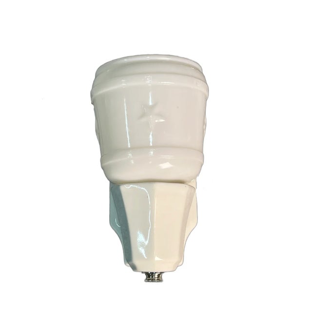 Porcelain sconce with milk glass shade and star design. 6.5” tall, backplate is about 6” by 3”, project 4”.