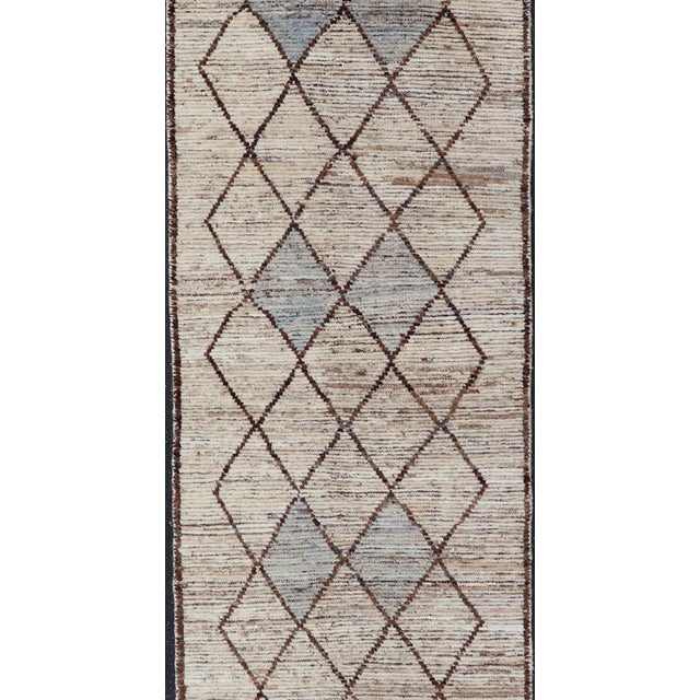 Measures: 3'2 x 12'6 The Elegant Modern Moroccan Style Tribal Runner is a stunning blend of traditional Moroccan motifs...