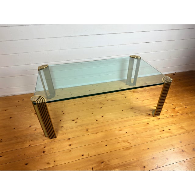 Modernist Art Deco Style Glass and Brass Coffee Table, 1980s, in Very Good conditions. Designed 1980 to 1989