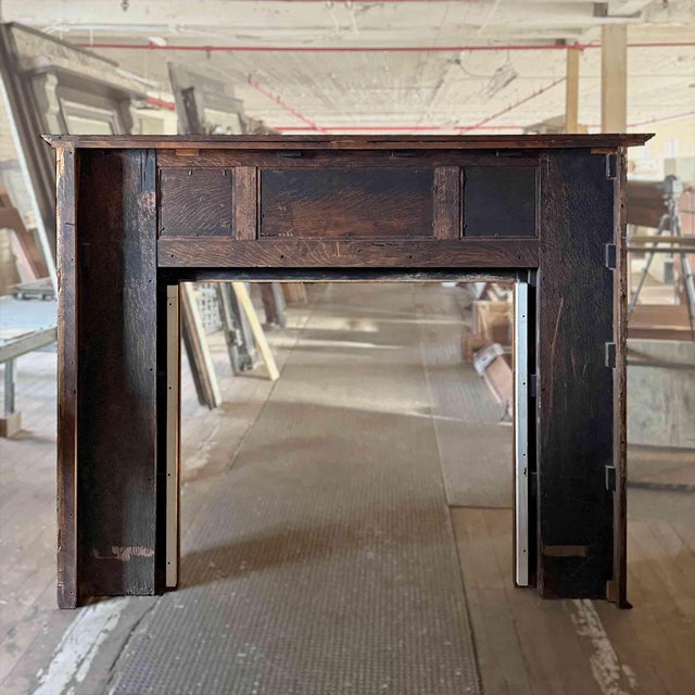 Antique carved oak fireplace mantel having full height, unfluted volute column supports, decorative capitals and...