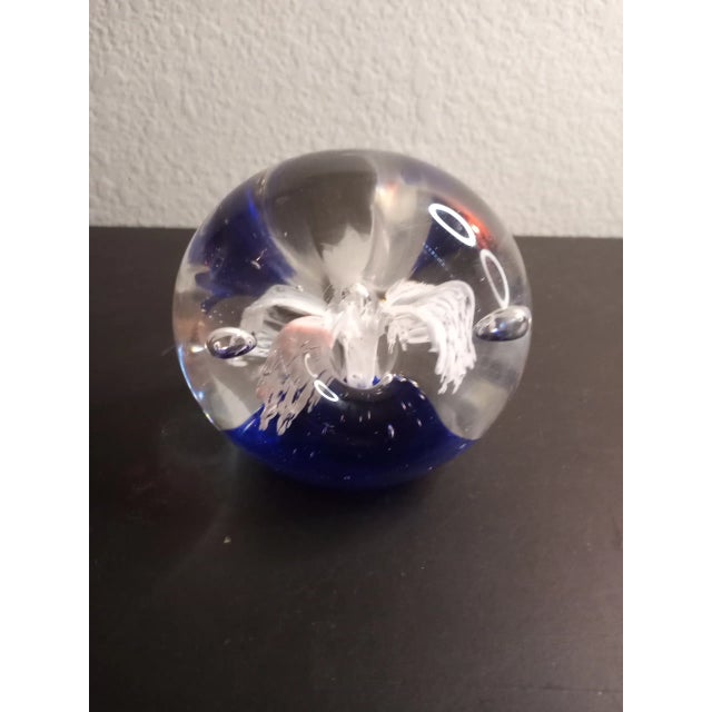 This is a Dynasty Gallery Heirloom 5" Cobalt Blue & White Sunburst Donut Paper Weight. Procured at auction